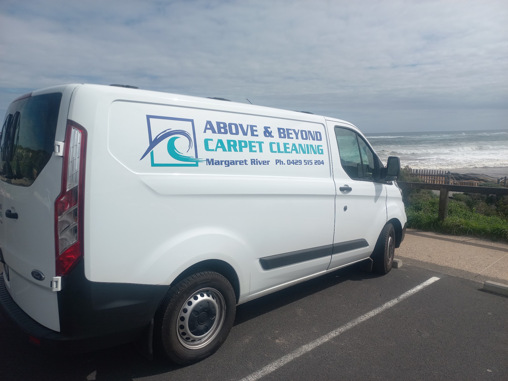 The Above and Beyond Carpet Cleaning van parked above a surf break on the Margaret River coast